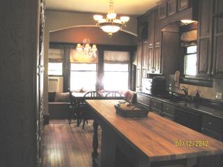 Kitchen with beautiful custom cabinets and brand new top of the line appliances including 5 burner gas cooktop, electric double oven, large side by side refrigerator with water & ice in door. Also wonderful breakfast nook with built in bench seating